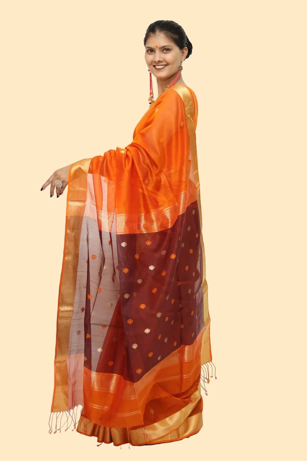 Vibrant Orange Drop motif handloom Saree with Tassels